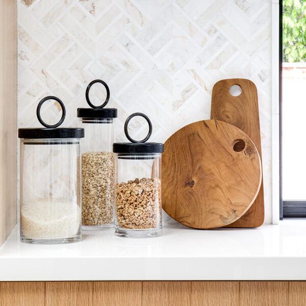 Canisters and cutting boards on a kitchen counter